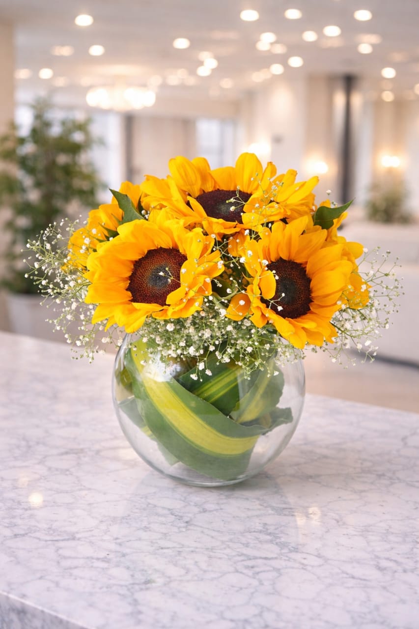 Bouquet of Sunflowers Arranged in a Glass Fish Bowl Vase