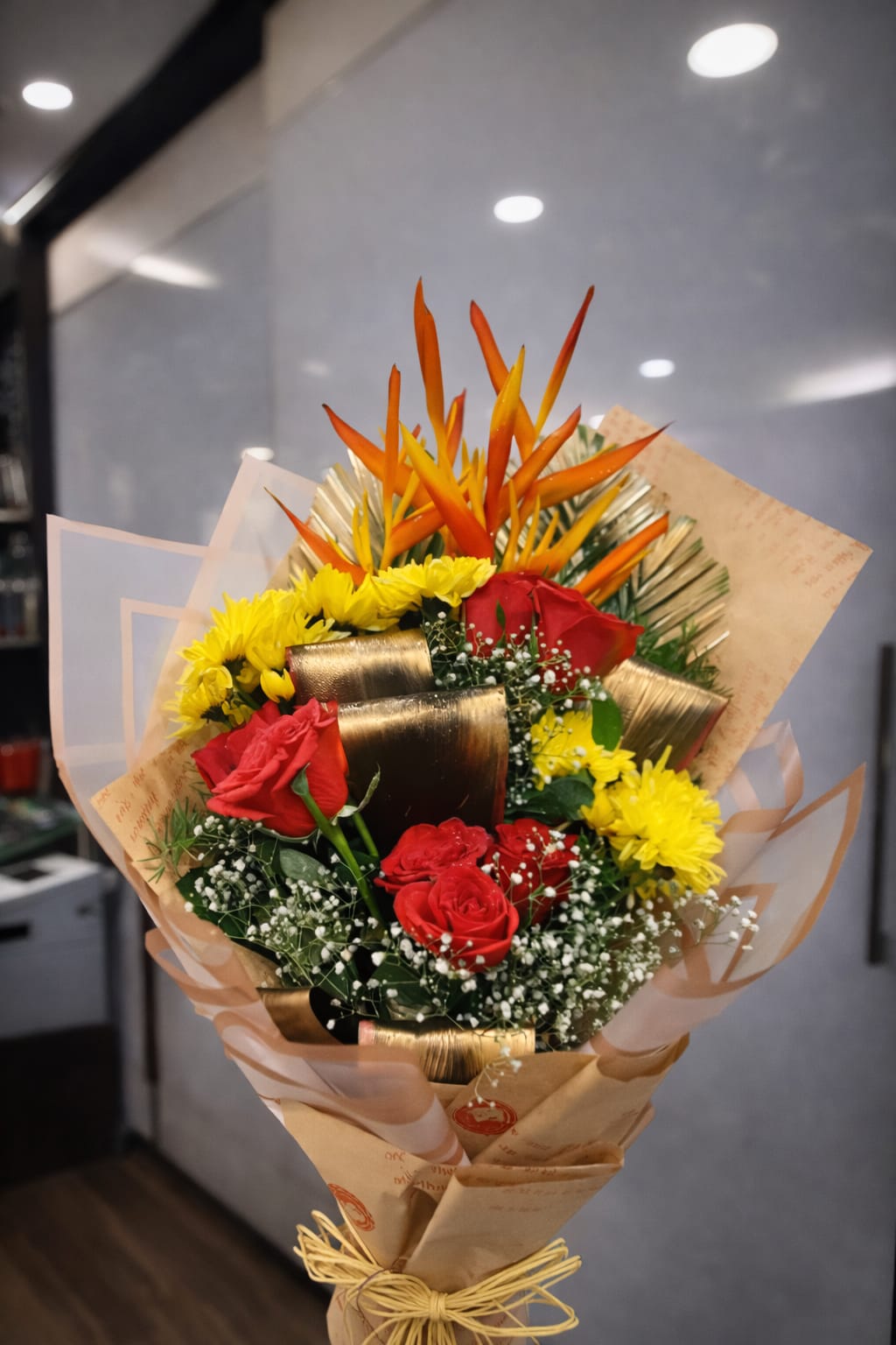 "Heliconia and red rose arrangement"