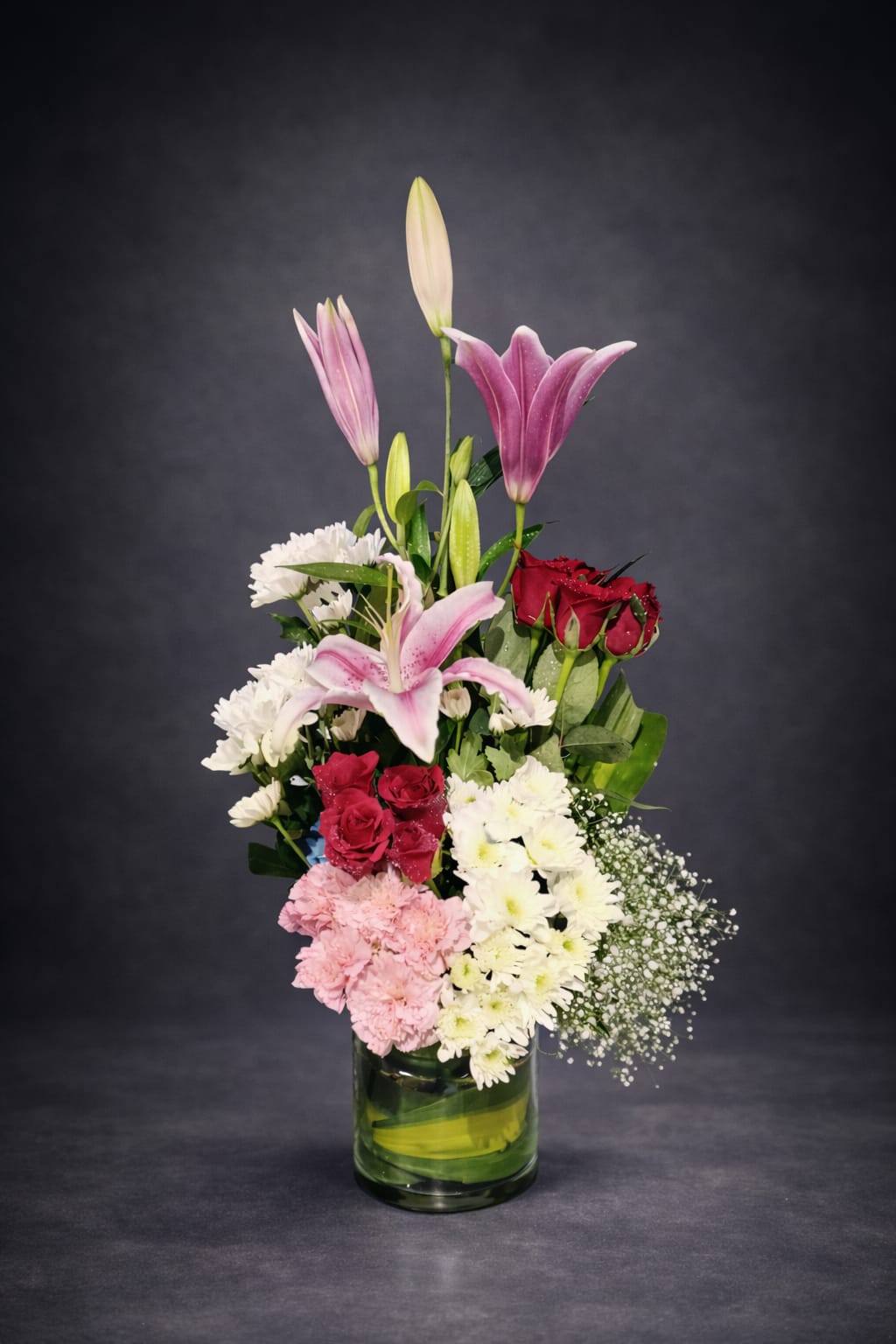 Mixed Floral Bouquet in a Glass Cylinder Vase.
